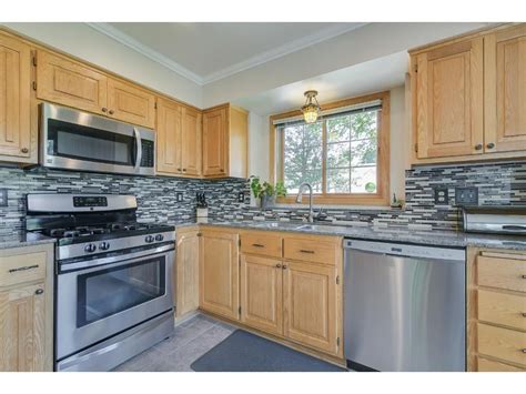 golden oak cabinets with stainless steel appliances|old oak kitchen cabinets.